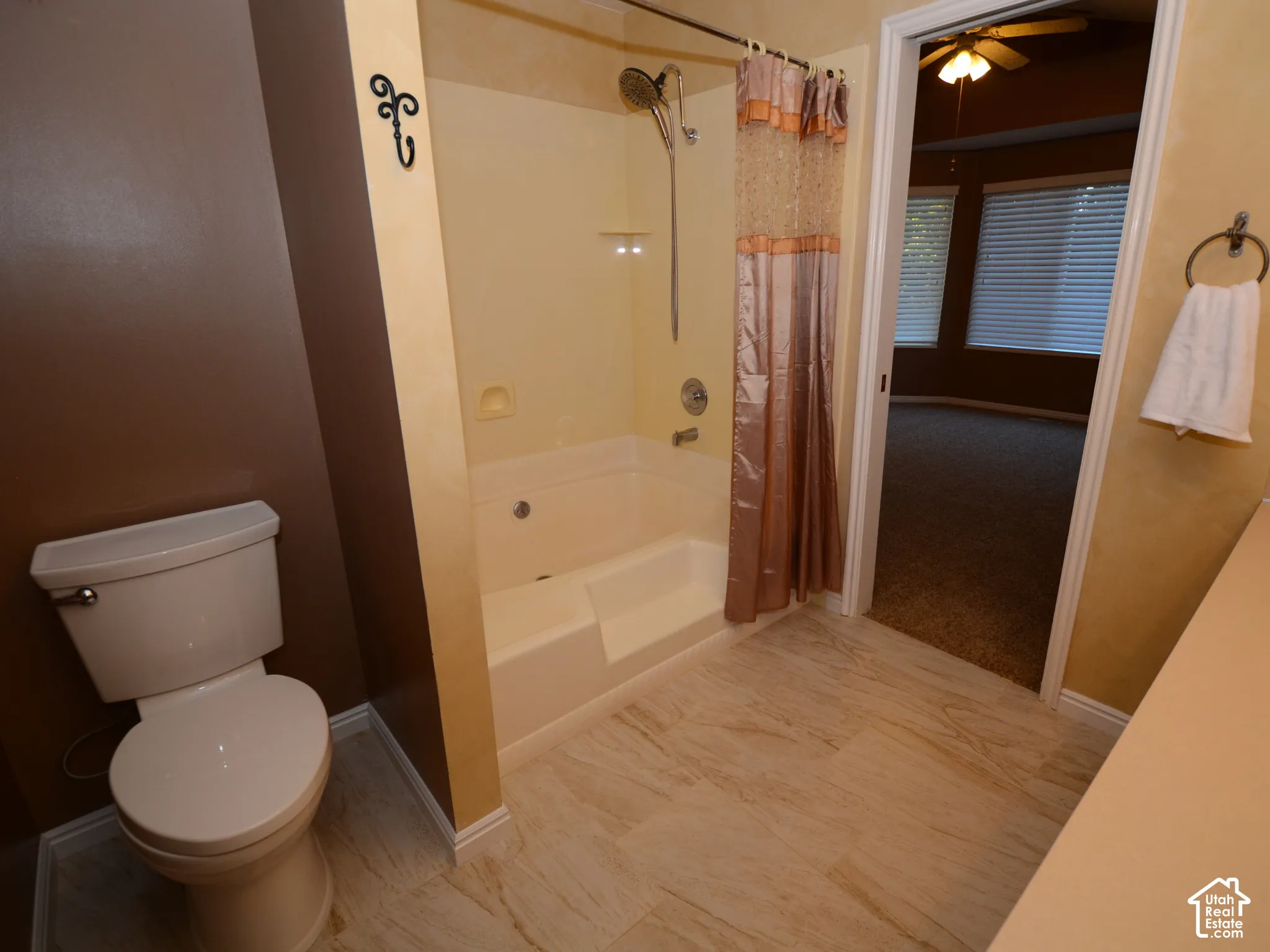 Full bathroom with tile flooring.
