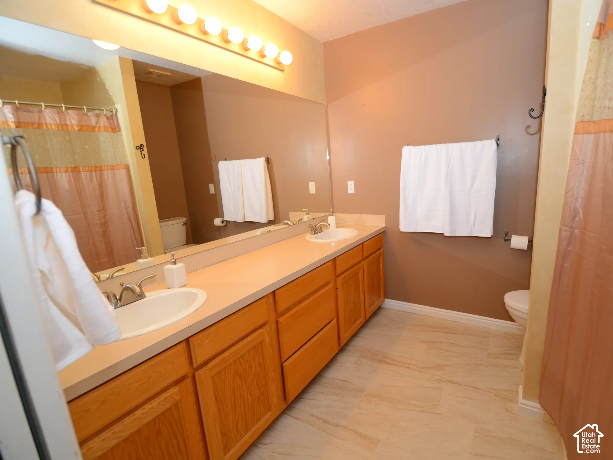 Primary bath dual vanity with pleanty of counter and mirror space.