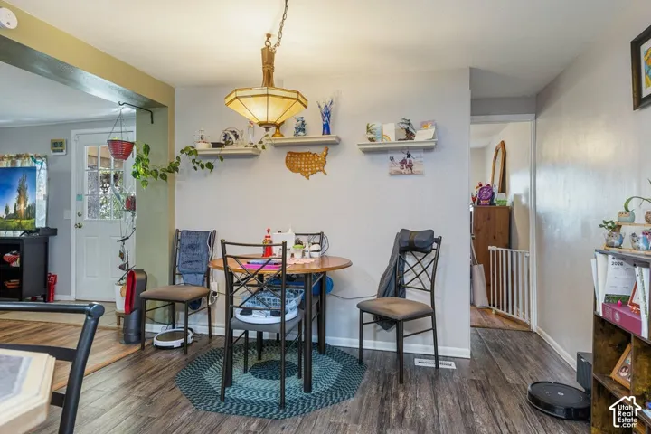 Wood-finish flooring throughout, with a built-in hanging light fixture