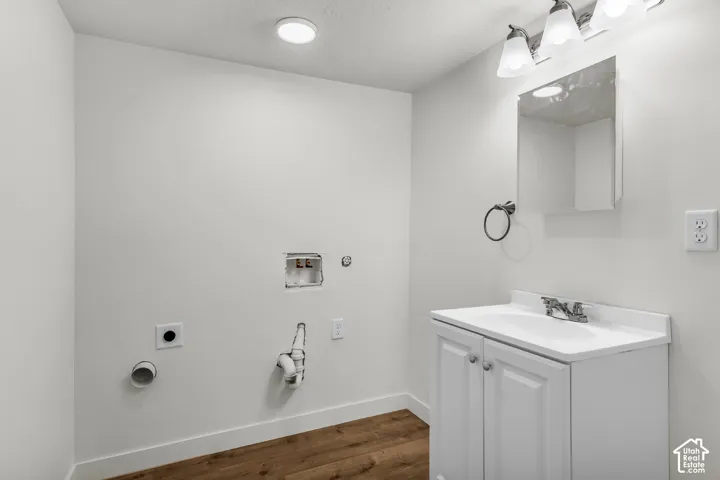 White vanity with an integrated sink and chrome faucet