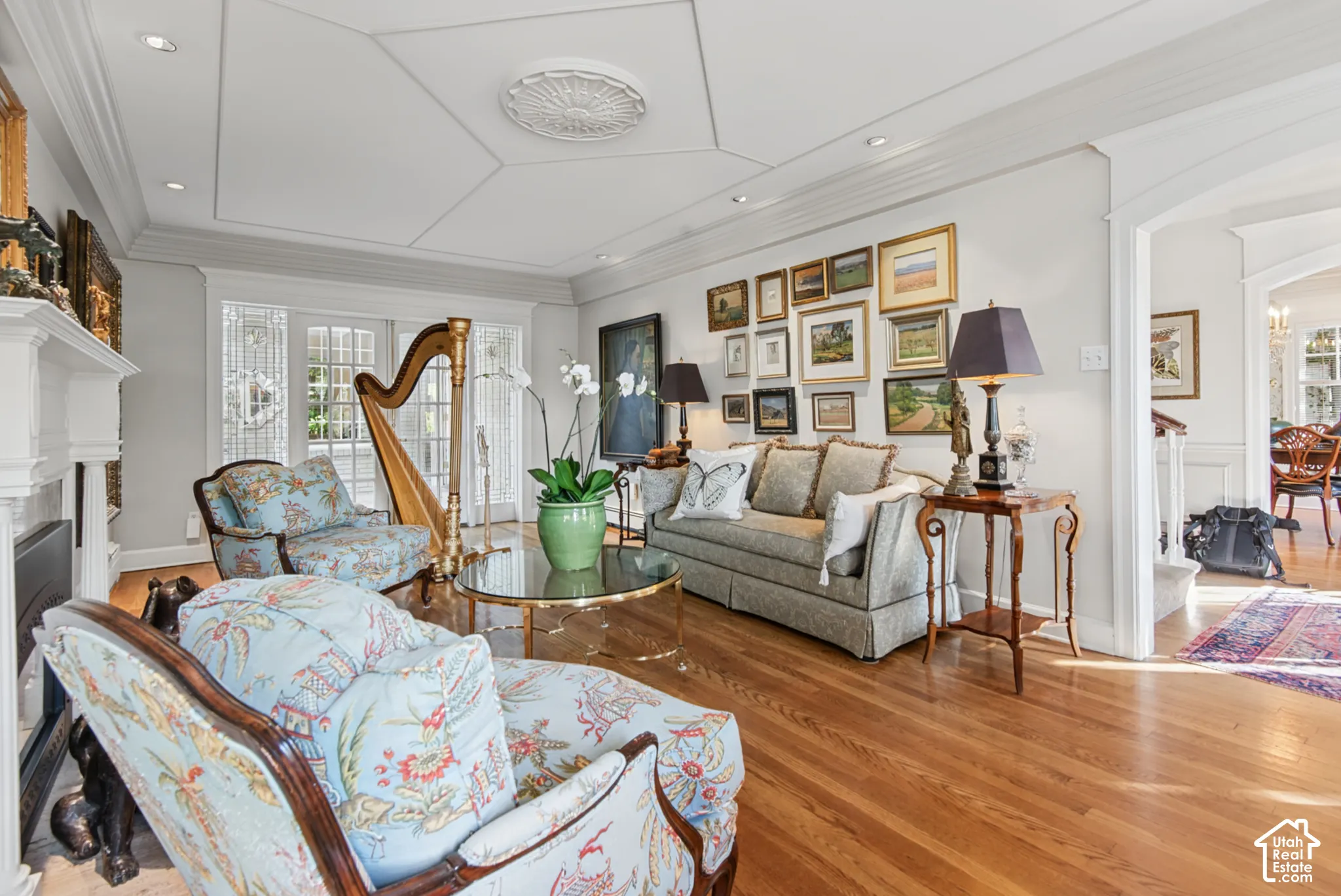 Wood-finish flooring throughout, recessed lighting, and crown molding