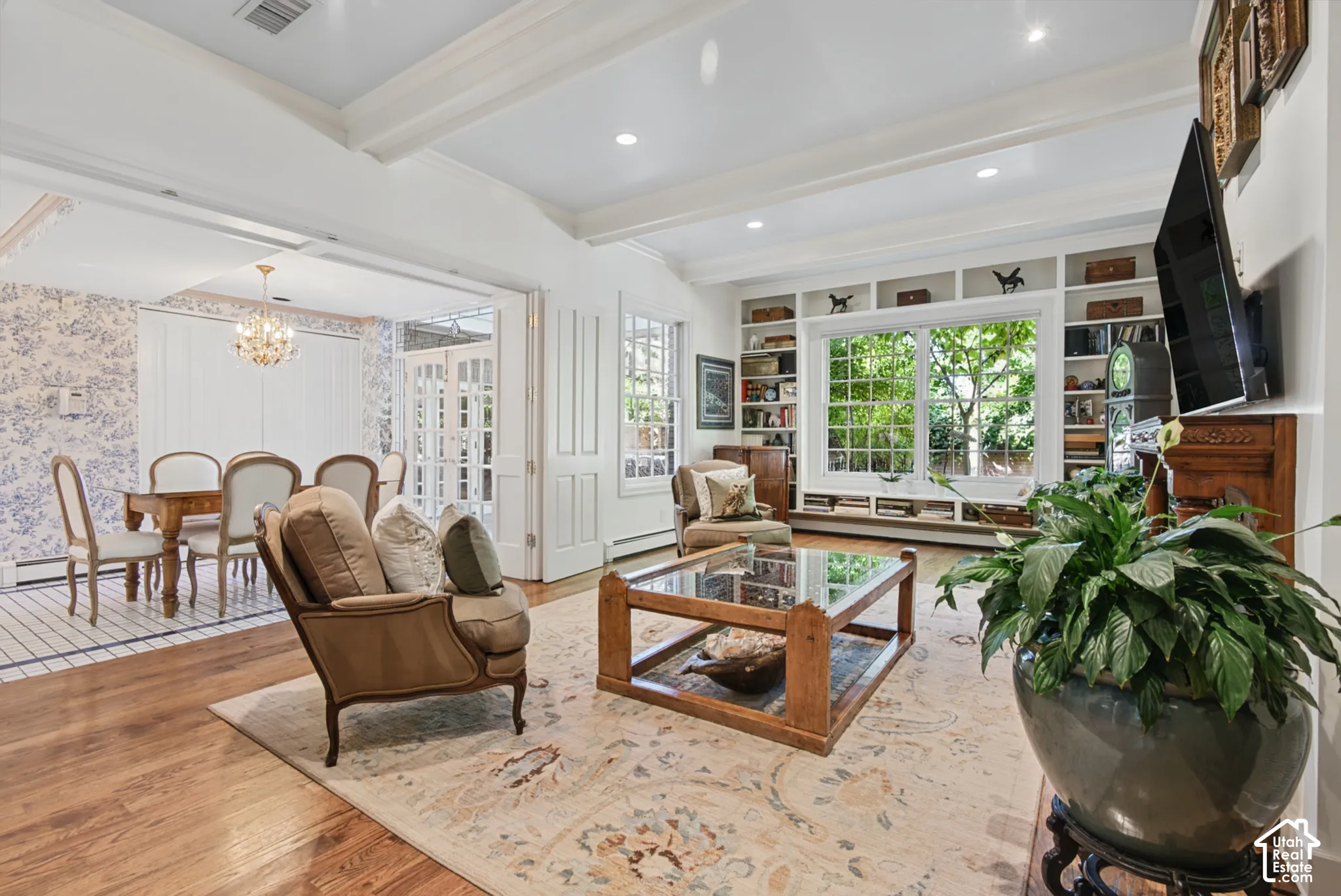 Hardwood flooring, recessed lighting, and white coffered ceilings