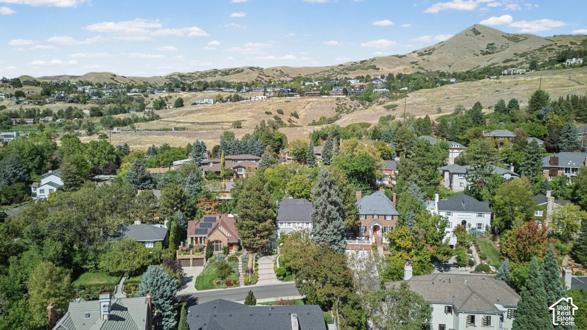 Residential neighborhood set against a mountainous backdrop