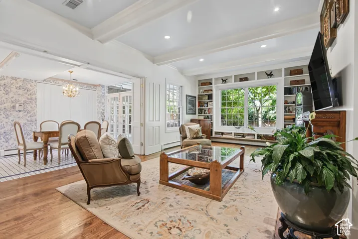Hardwood flooring, recessed lighting, and white coffered ceilings