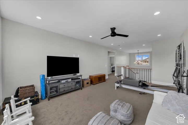 Recessed lighting, ceiling fan, carpet flooring, and white painted walls