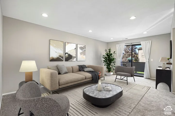 Sophisticated living room featuring a neutral color palette with recessed ceiling lighting, large glass sliding doors with operable curtains, striped area rug, and built-in shelving with integrated storage