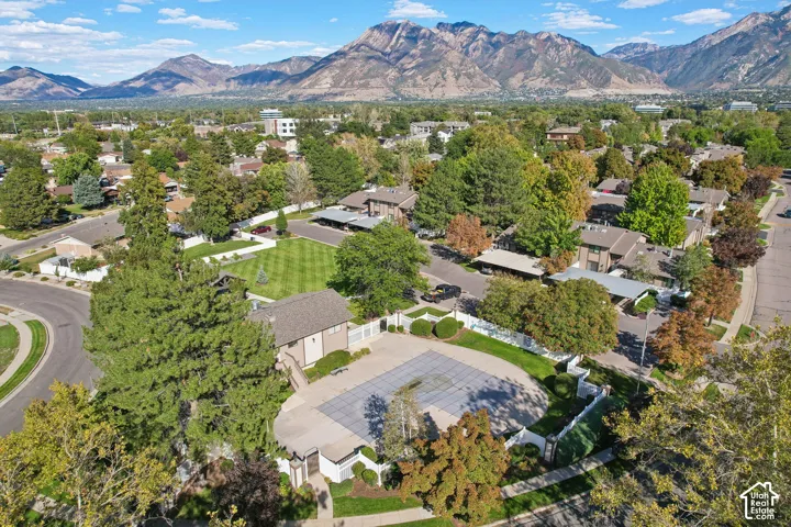 Community amenities including a covered swimming pool, clubhouse, and green space