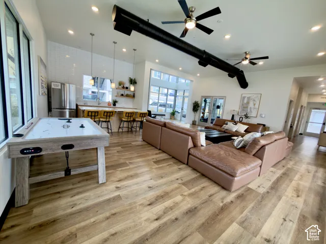 Clubhouse gathering area with kitchen, game table & couches