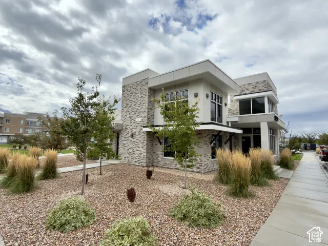 Clubhouse with a modern exterior architecture featuring a multi-level design and large windows