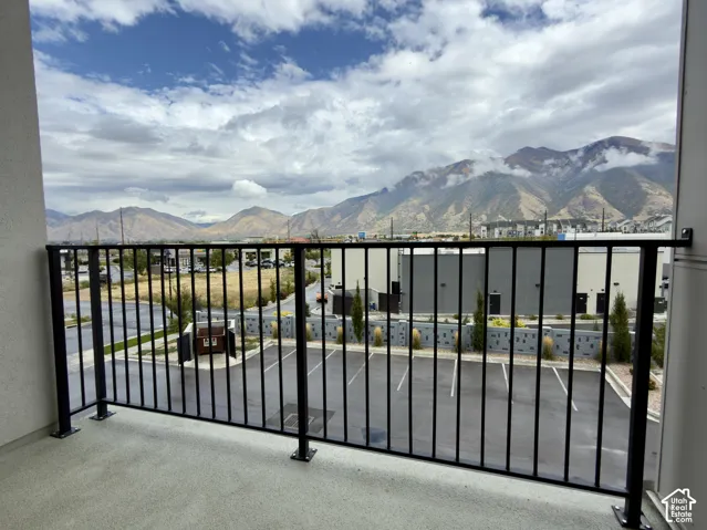 Balcony off the family room featuring black metal railing with an unobstructed mountain view
