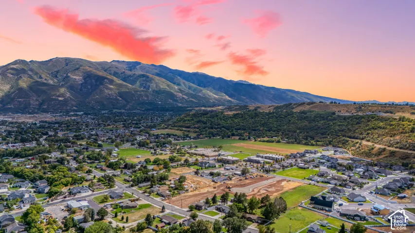 Expansive mountain scenery with residential areas and green spaces