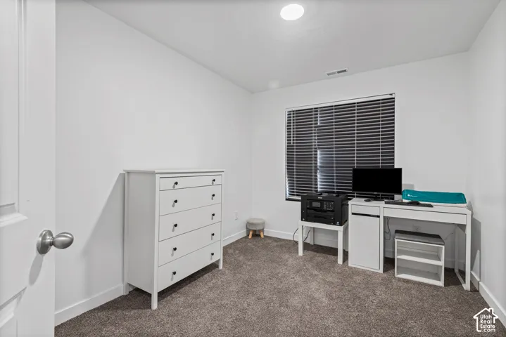 Recessed ceiling lighting, window with blinds, and neutral carpeting