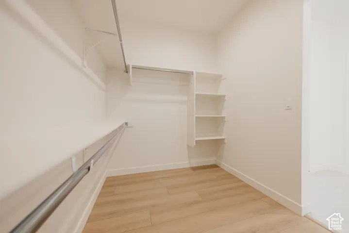 Walk-in closet with integrated shelving units