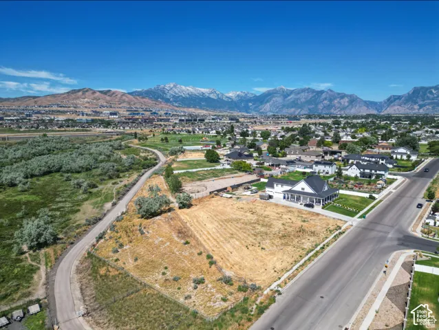 Expansive land parcel with surrounding residential development and paved roadways