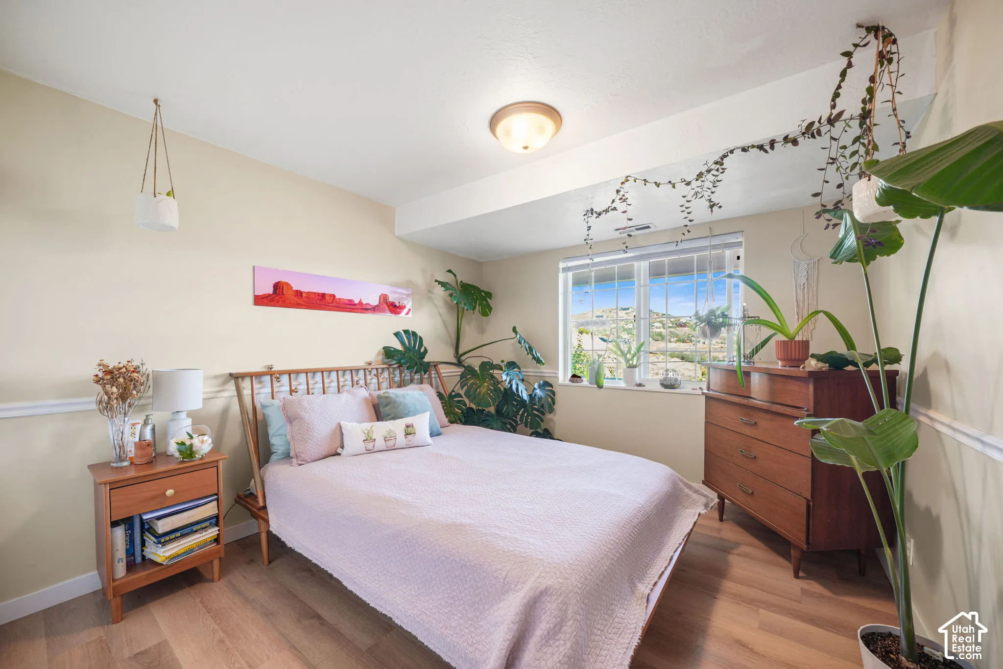 Wood-finish flooring, recessed window, and overhead flush mount lighting