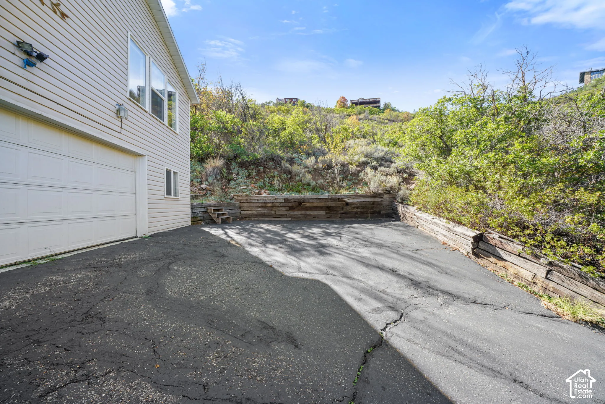 Attached garage with white panel door