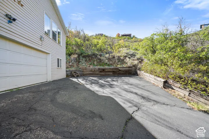 Attached garage with white panel door