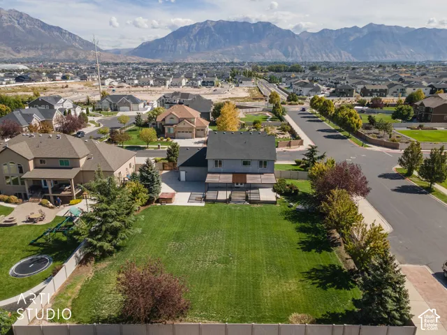 Expansive green lawn with mountain backdrop