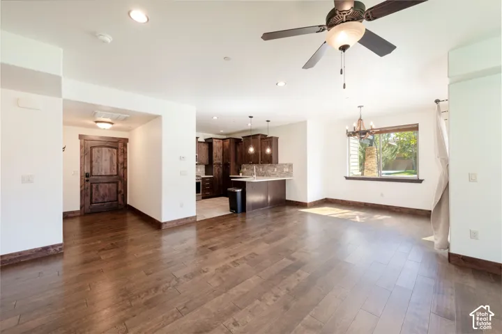 Open concept living area featuring wood-finish flooring, recessed lighting, and a ceiling fan