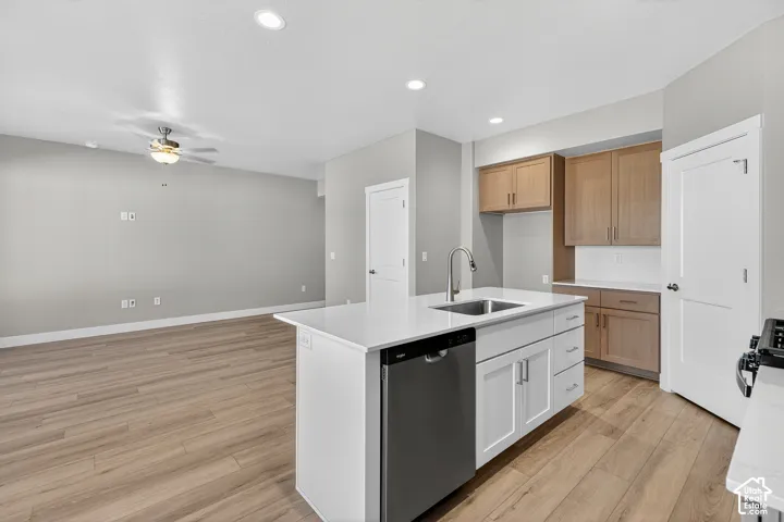 Kitchen island with an undermount sink and integrated dishwasher