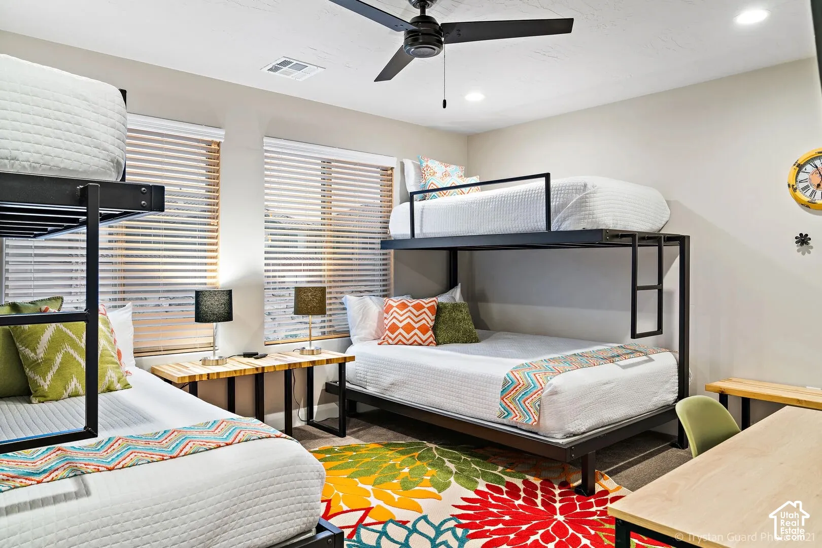 Room featuring two metal-frame bunk beds, a ceiling fan, recessed lighting, and dual windows with horizontal blinds
