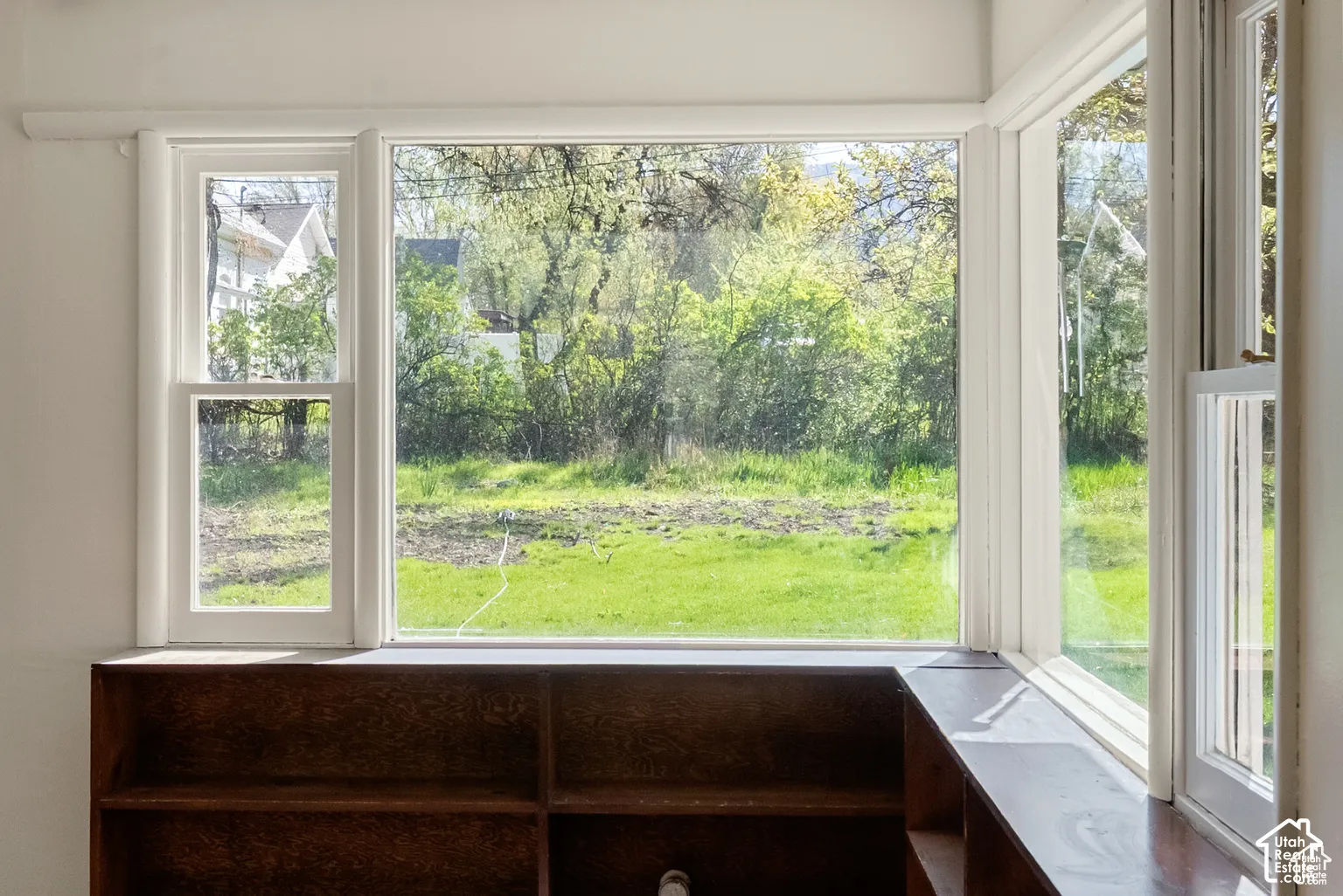 Expansive bay window with white trim, offering multiple panes