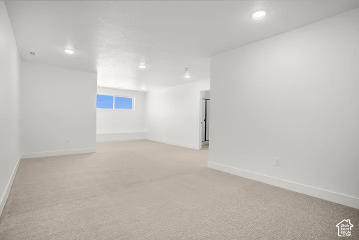 Bonus/flex Expansive room featuring recessed lighting, light-toned carpet, and multiple windows