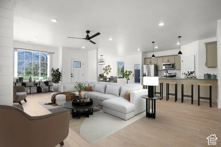 Granite digital furniture -Open-concept living area with wood-finish flooring, recessed lighting, and a contemporary ceiling fan