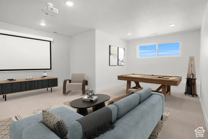added digital furniture to show bonus room/flex room -Recessed lighting, mounted projector, large projection screen, built-in entertainment console, and a rectangular window