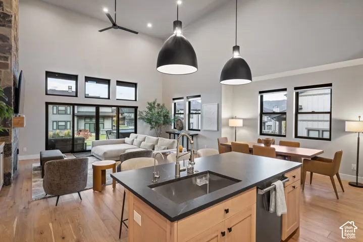 Soaring vaulted ceilings with recessed lighting and a ceiling fan