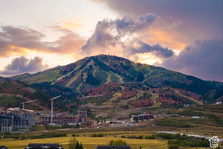 Mountain landscape with varied foliage and scattered structural developments