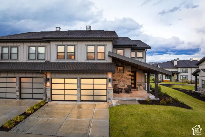 Modern exterior with vertical siding and stone accents
