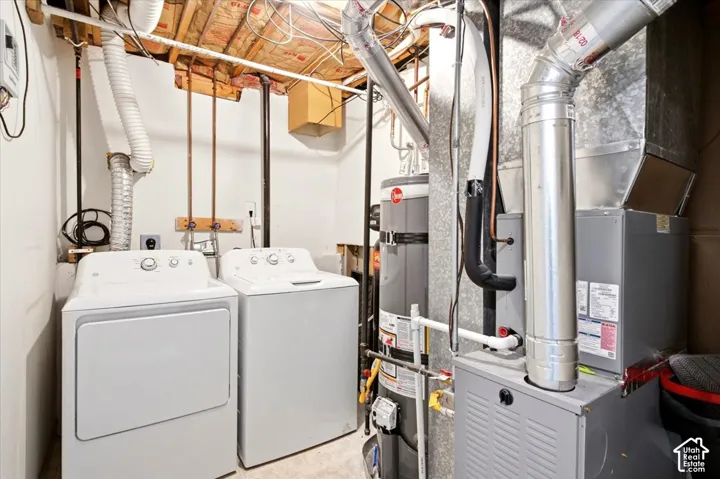 Laundry area featuring a side-by-side washer and dryer
