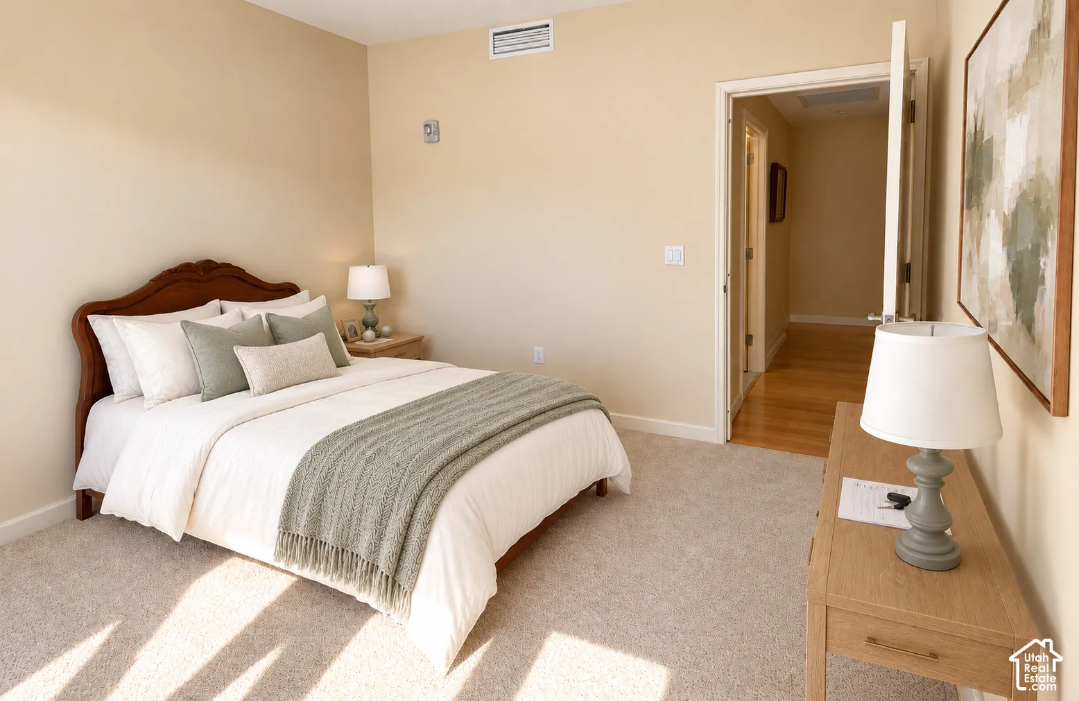 Plush carpeting, neutral wall tones, and overhead ventilation
