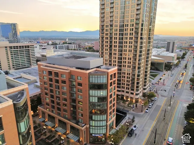 Urban high-rise living featuring a distinctive curved brick and glass facade with multiple levels of residential units