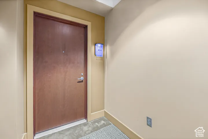 Rich wood-finish entry door with coordinating trim