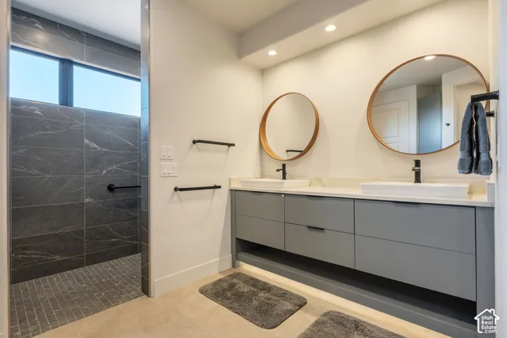 Dual vanity with vessel sinks and black fixtures