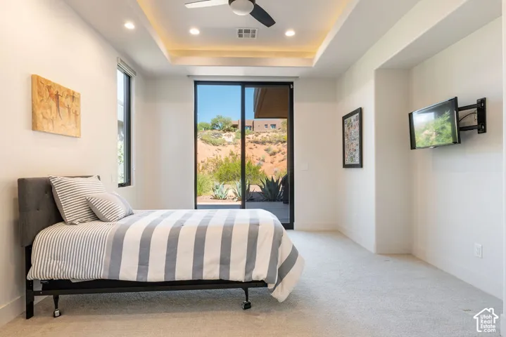Tray ceiling with recessed lighting and a ceiling fan