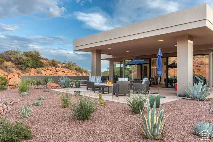 Expansive xeriscaped yard with red gravel and diverse desert plantings