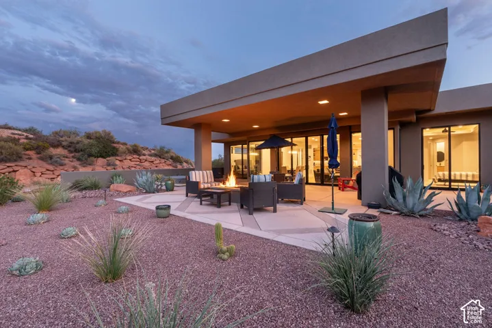 Expansive covered patio with recessed lighting and a built-in fire pit