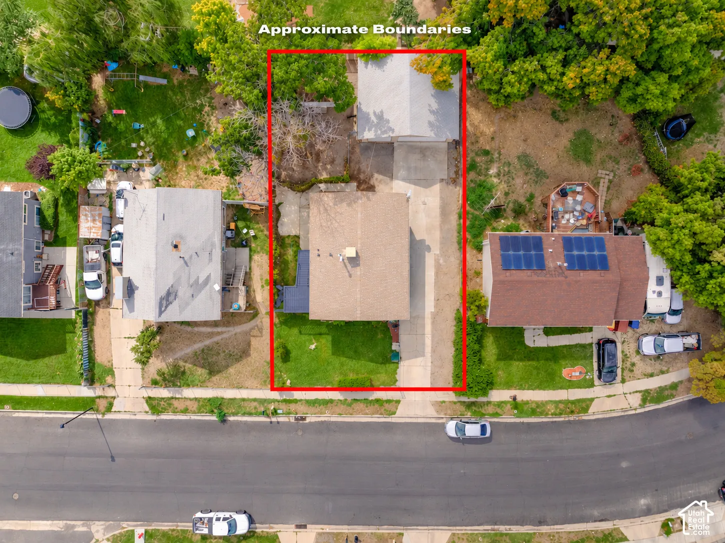 Aerial view highlighting the property and lot.