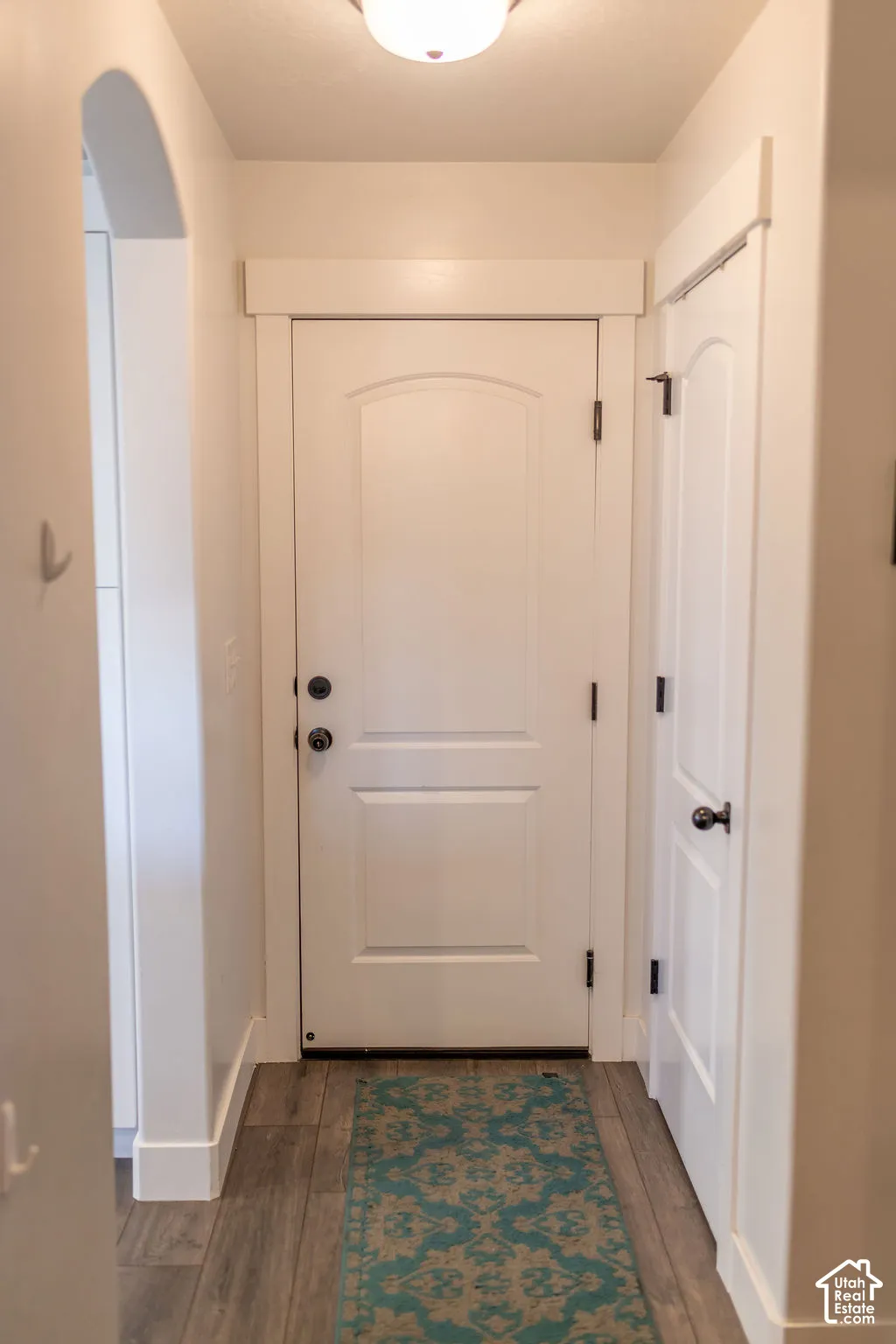 Wood-finish flooring with crisp white trim