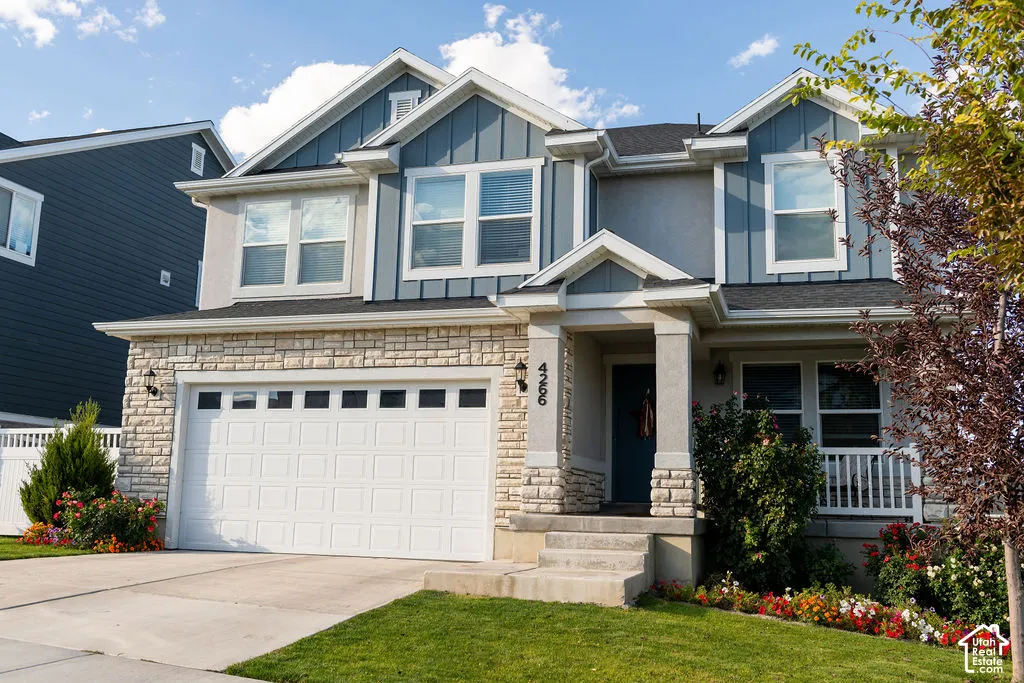 Two-story home with a stone and siding exterior