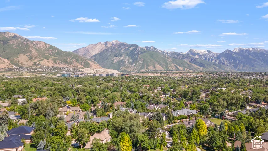 Expansive community surrounded by mature trees and mountain ranges