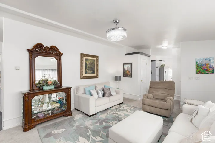 Coved ceiling trim, recessed lighting, and a decorative ceiling fixture illuminate the space