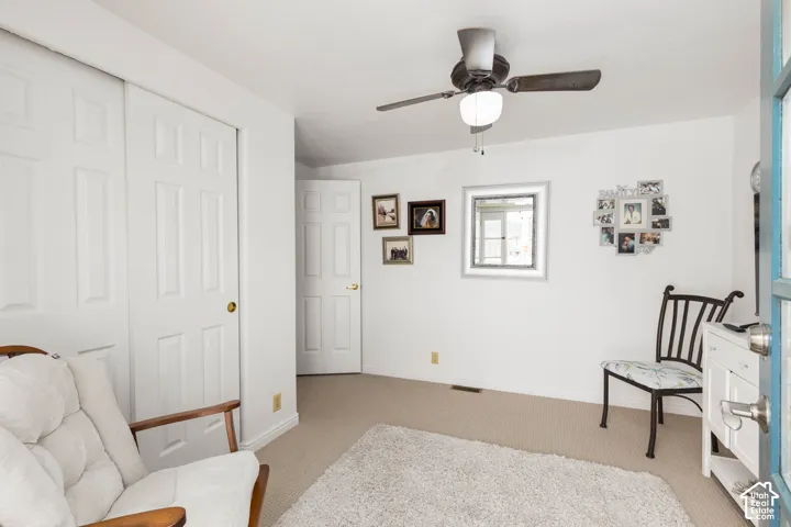 Recessed lighting, ceiling fan, carpeted flooring, paneled interior doors, and a window for natural light