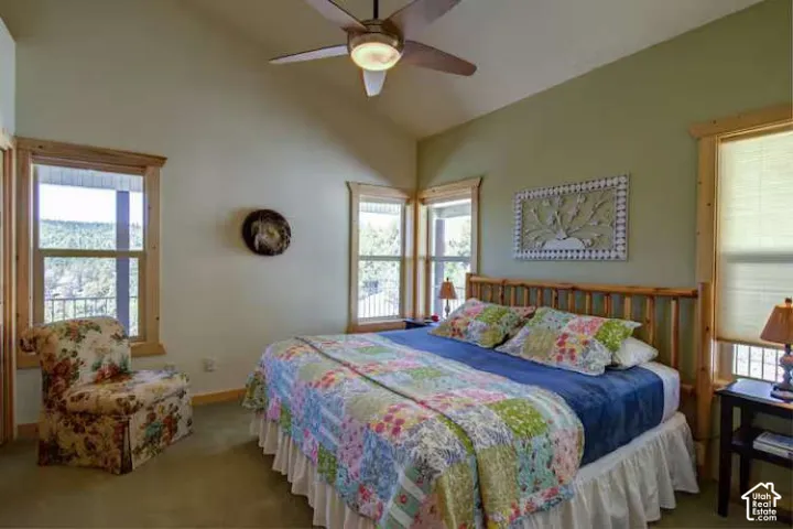 Vaulted ceilings complement natural wood window trim, creating a bright and open atmosphere