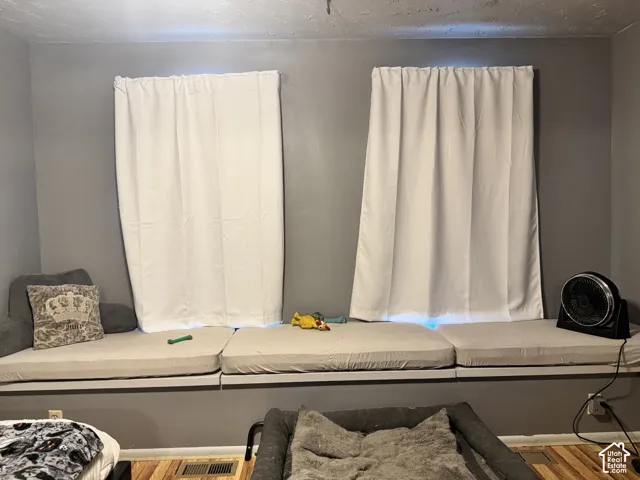 Built-in window bench with cushioned seating and privacy curtains