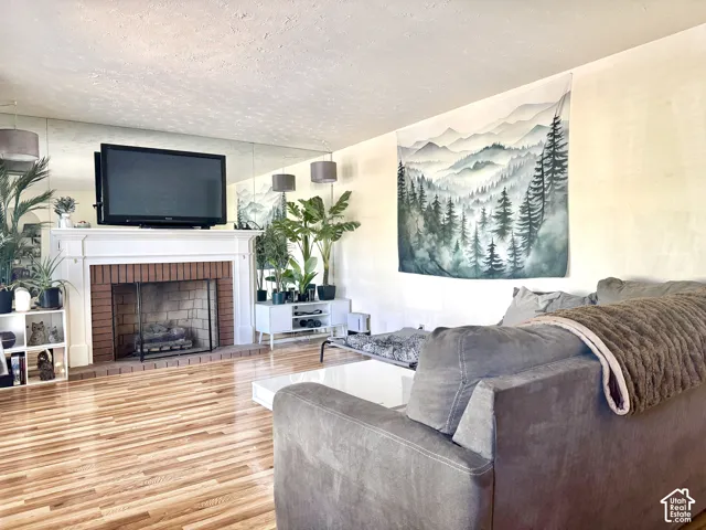 Wood-finish flooring throughout the room