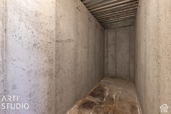 Concrete walls and flooring with an exposed metal ceiling